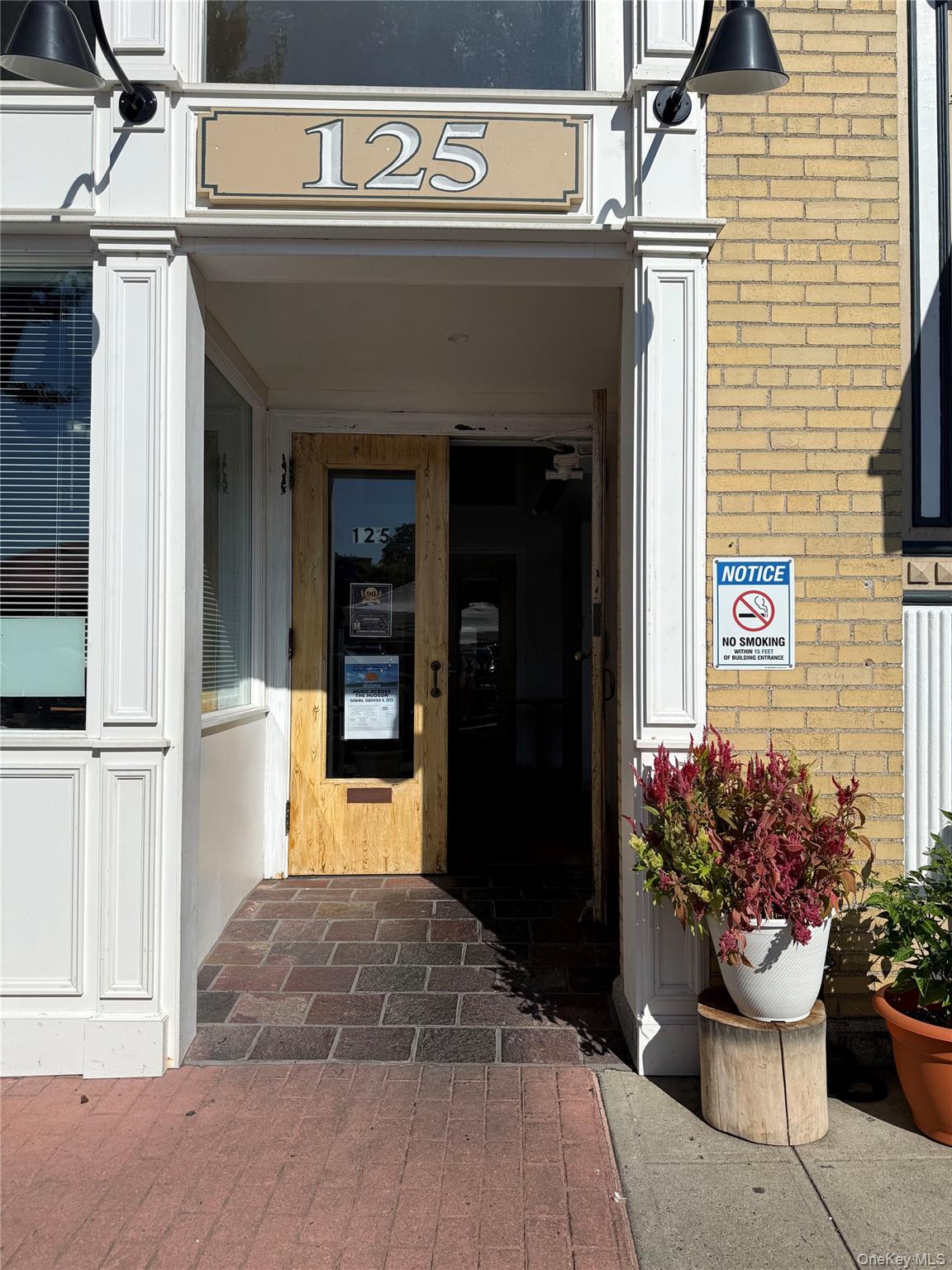 125 Main Street, Unit 2A Ossining, NY 10562 - Photo 2 of 23 a front view of a house with a garden