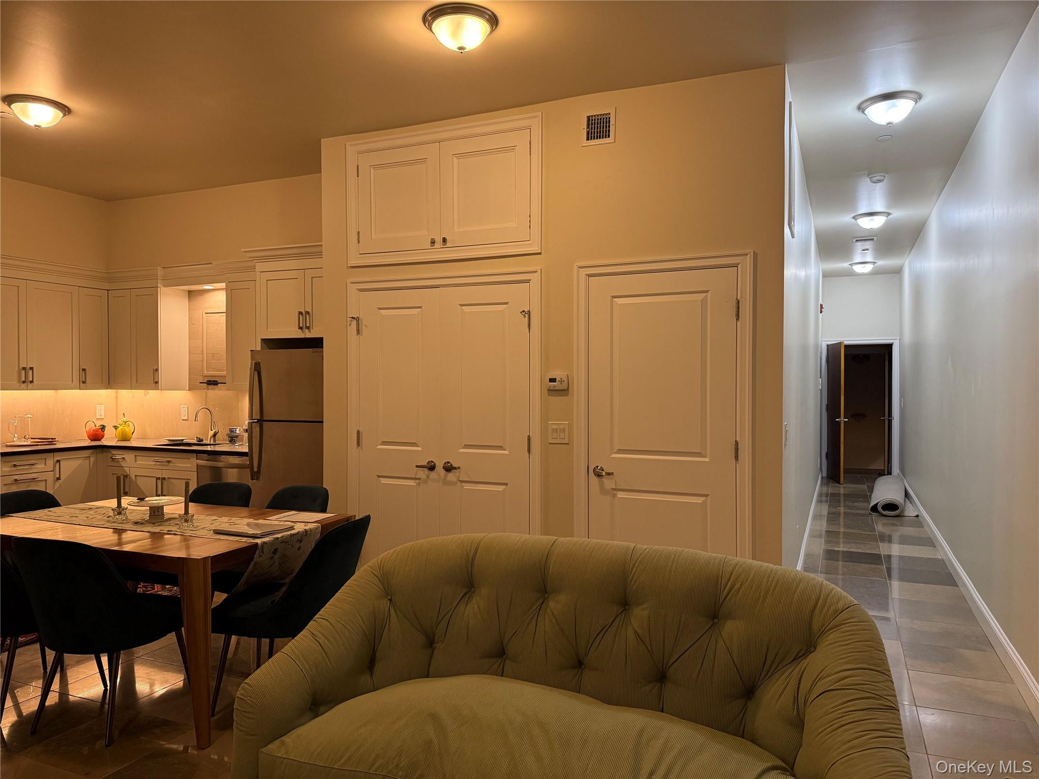 125 Main Street, Unit 2A Ossining, NY 10562 - Photo 9 of 23 a living room with furniture and a table