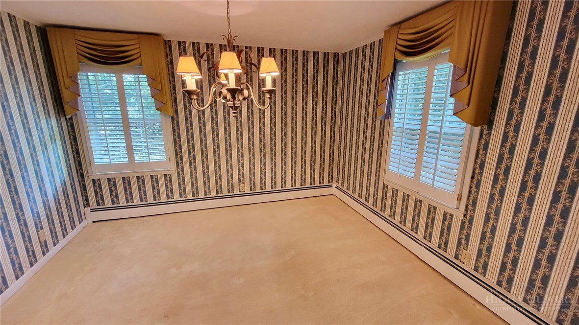 247 Crest Drive Boone, NC 28607 - Photo 8 of 19 a view of an empty room with a window