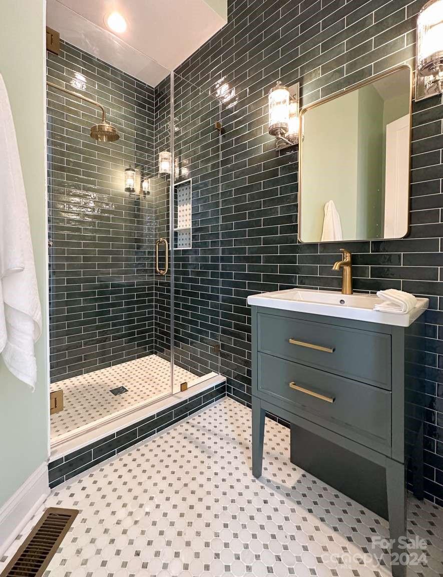 8316 Rolling Fields Road Charlotte, NC 28227 - Photo 20 of 35 a bathroom with a sink toilet and shower