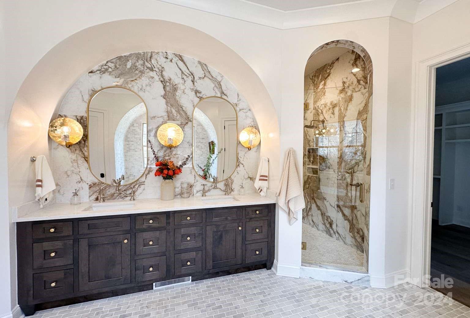 8316 Rolling Fields Road Charlotte, NC 28227 - Photo 22 of 35 a bathroom with a granite countertop sink a mirror and a shower