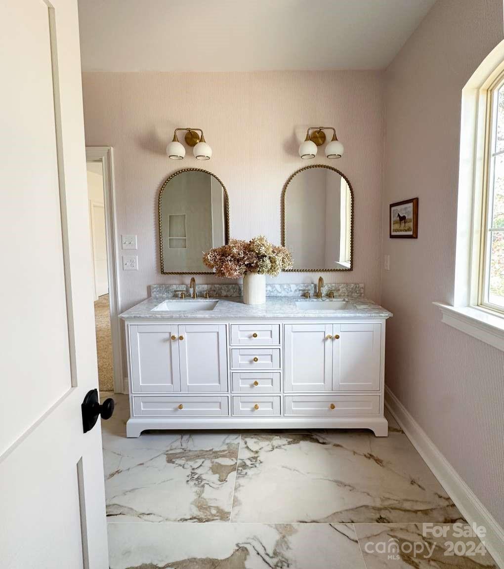 8316 Rolling Fields Road Charlotte, NC 28227 - Photo 28 of 35 a bathroom with a sink and a mirror