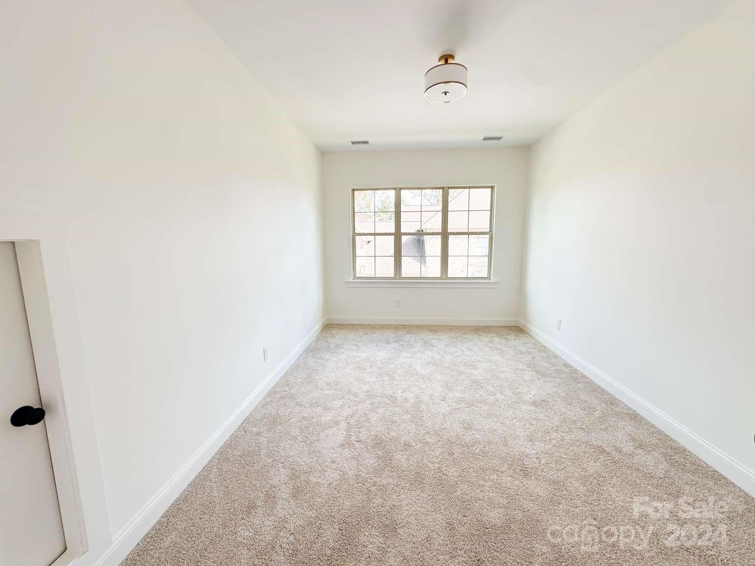 8316 Rolling Fields Road Charlotte, NC 28227 - Photo 33 of 35 an empty room with a window