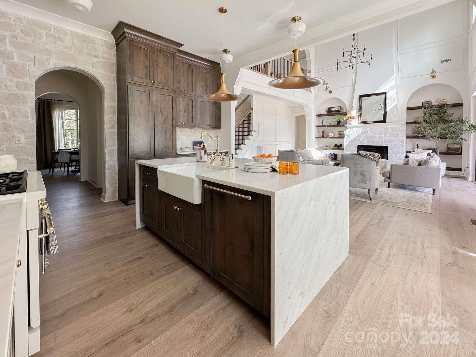 8316 Rolling Fields Road Charlotte, NC 28227 - Photo 9 of 35 a view of a kitchen with furniture and wooden floor