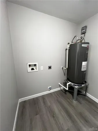 a view of a workspace with wooden floor