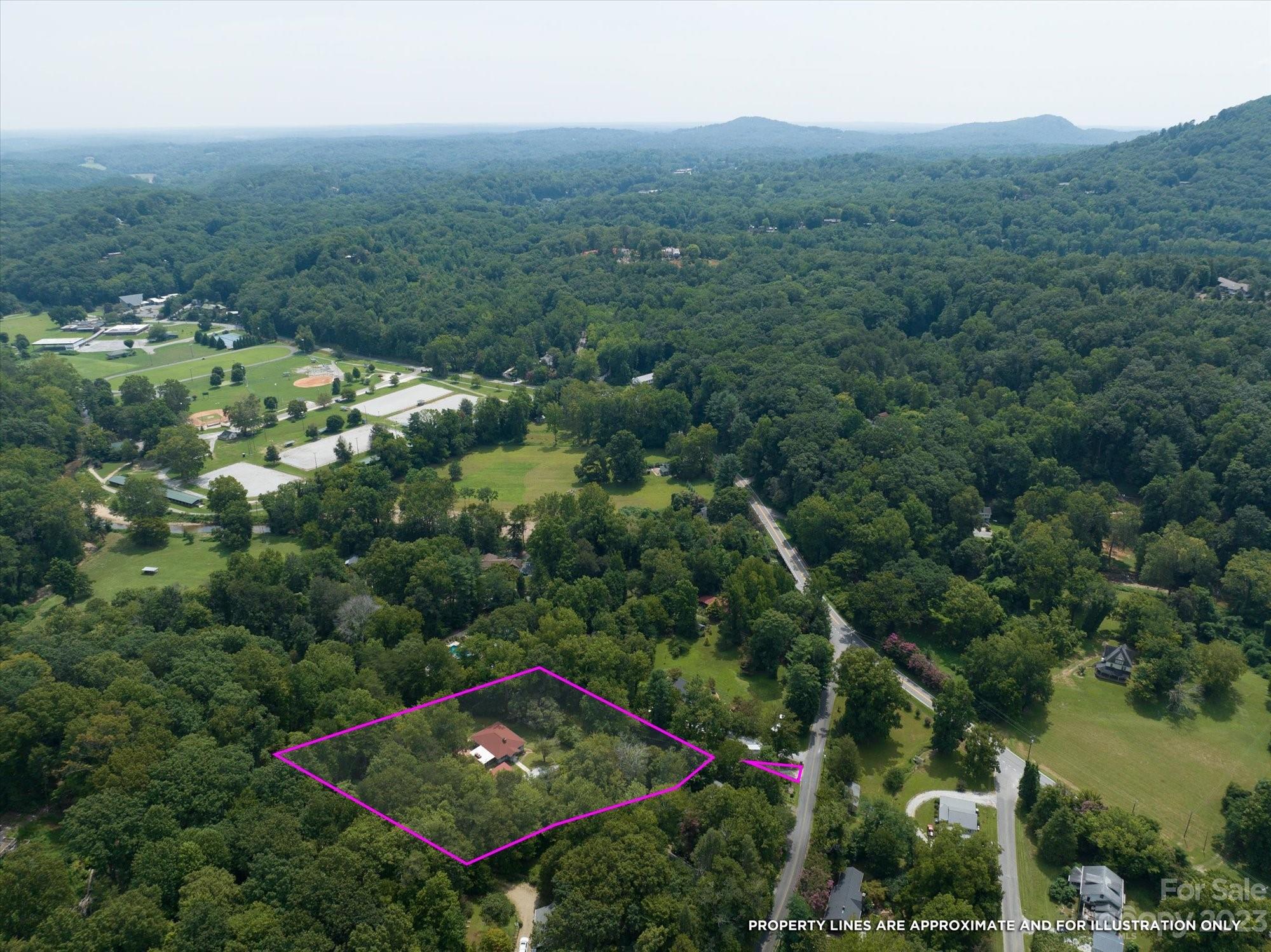 64 Vineyard Road Tryon, NC 28782 - Photo 3 of 45 an aerial view of house with yard