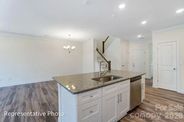 a kitchen with sink cabinets and outdoor view