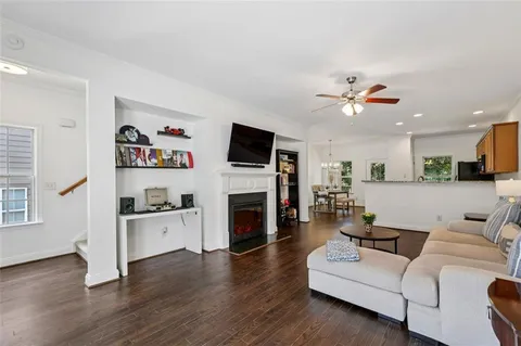 a living room with furniture fireplace and flat screen tv