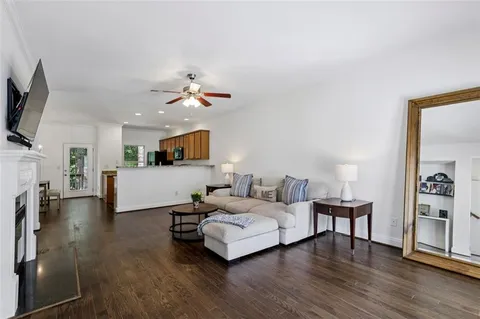a spacious bedroom with a bed and a flat screen tv