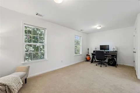 a bedroom with furniture and a window