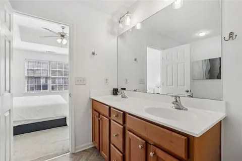 a bathroom with a sink double vanity and a mirror