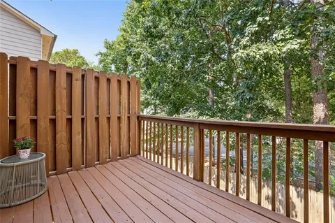 a view of a house with a yard and flower plants