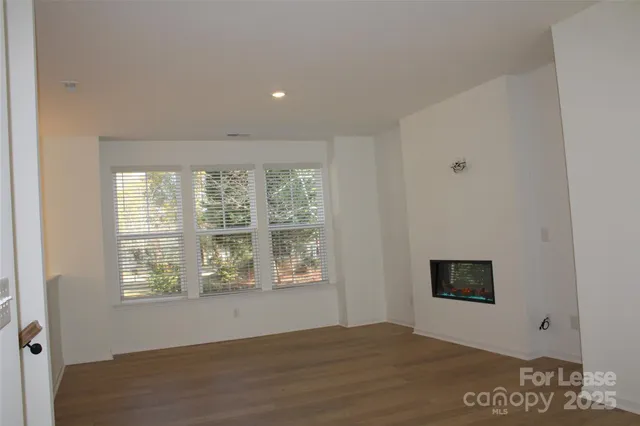 a view of a kitchen with a refrigerator a microwave and a refrigerator