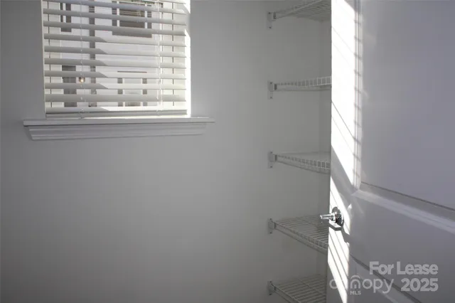 a bathroom with a shower sink vanity mirror and toilet