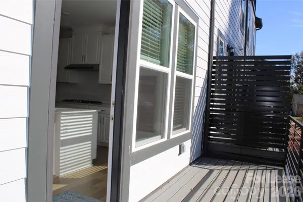 a view of a balcony with a door