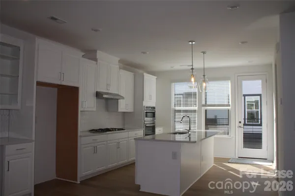 a kitchen with counter top space cabinets and stainless steel appliances