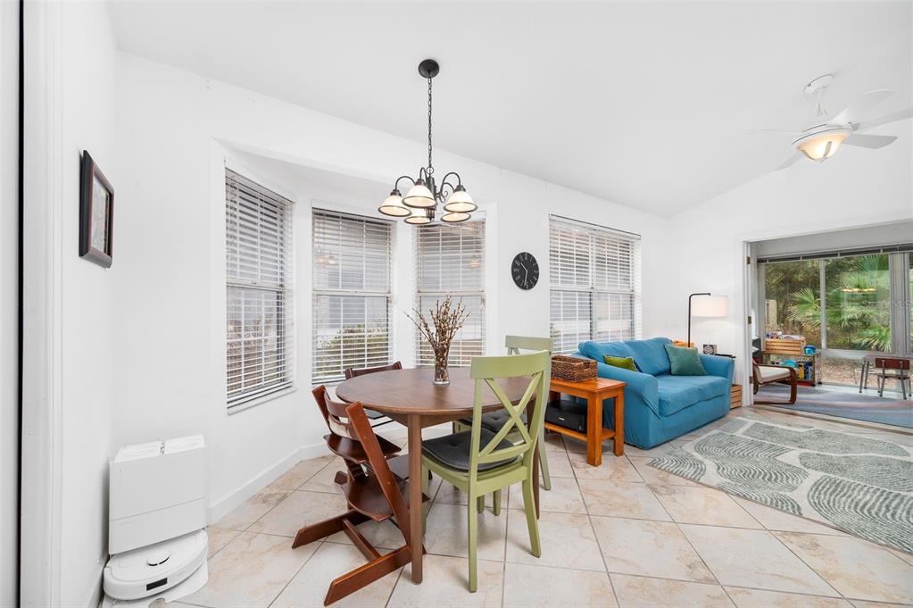 5154 Southwest 88 Terrace Gainesville, FL 32608 - Photo 13 of 29 a view of a dining room with furniture window and outside view