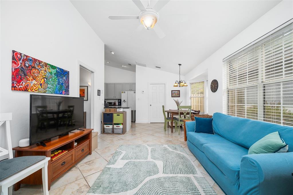 5154 Southwest 88 Terrace Gainesville, FL 32608 - Photo 14 of 29 a living room with furniture and a flat screen tv