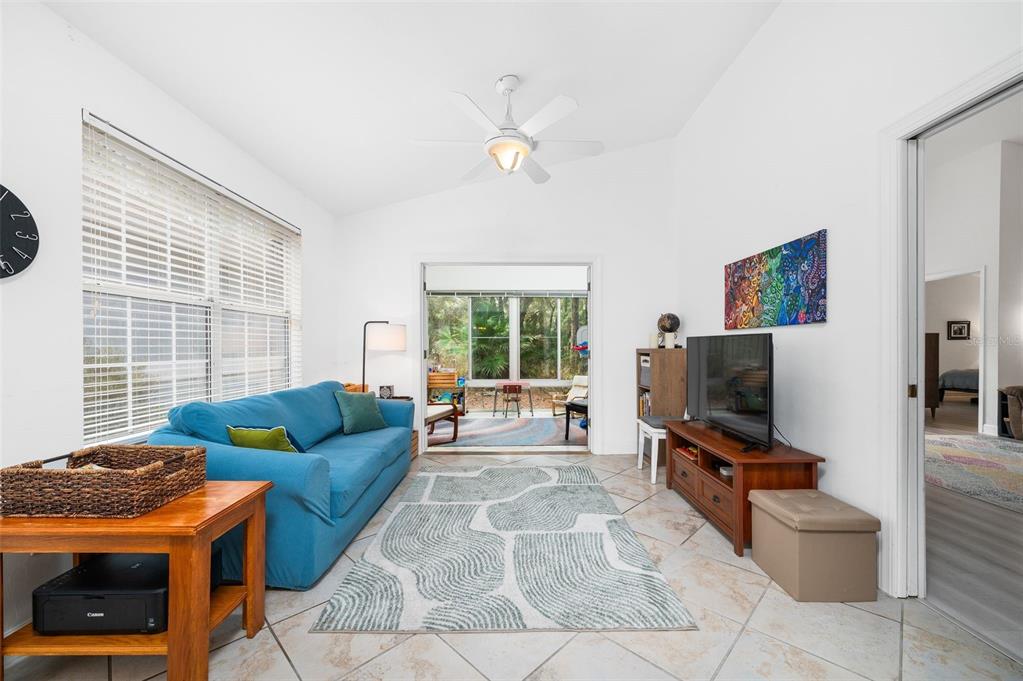 5154 Southwest 88 Terrace Gainesville, FL 32608 - Photo 15 of 29 a living room with furniture and a flat screen tv