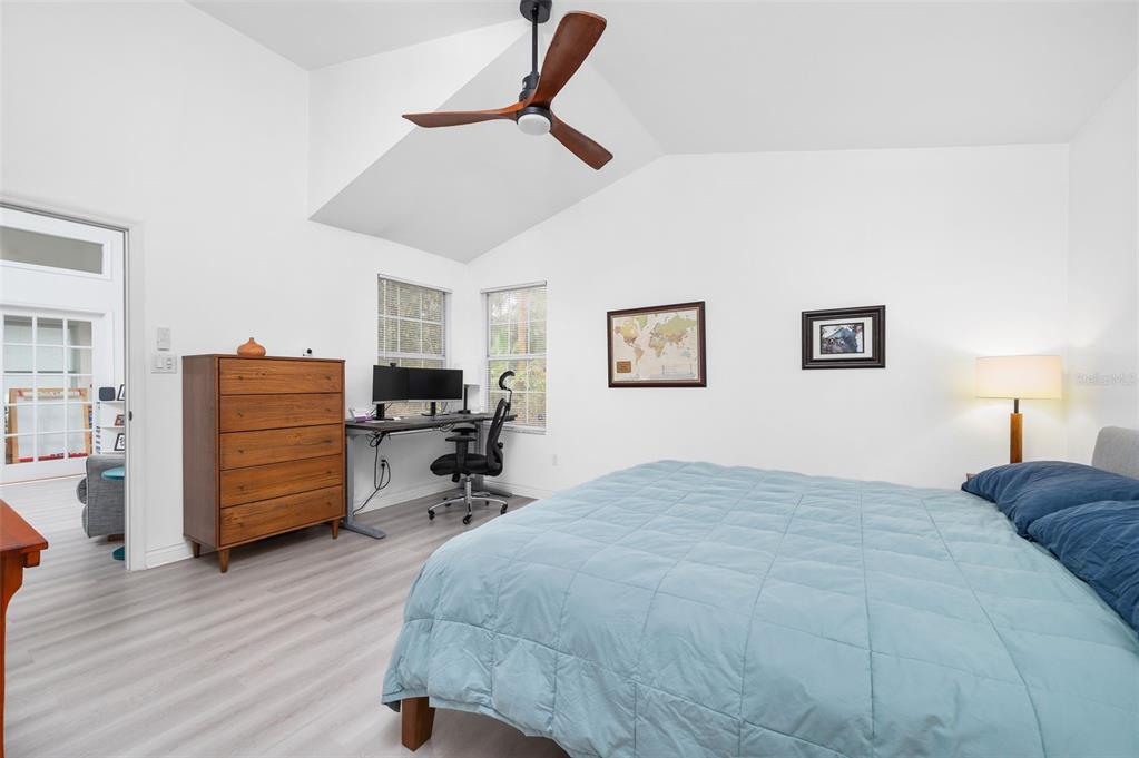 5154 Southwest 88 Terrace Gainesville, FL 32608 - Photo 18 of 29 a bedroom with a bed and wooden floor