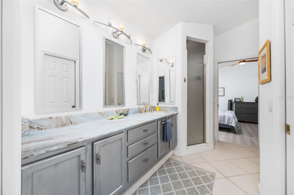 5154 Southwest 88 Terrace Gainesville, FL 32608 - Photo 21 of 29 a bathroom with a double vanity sink mirror and