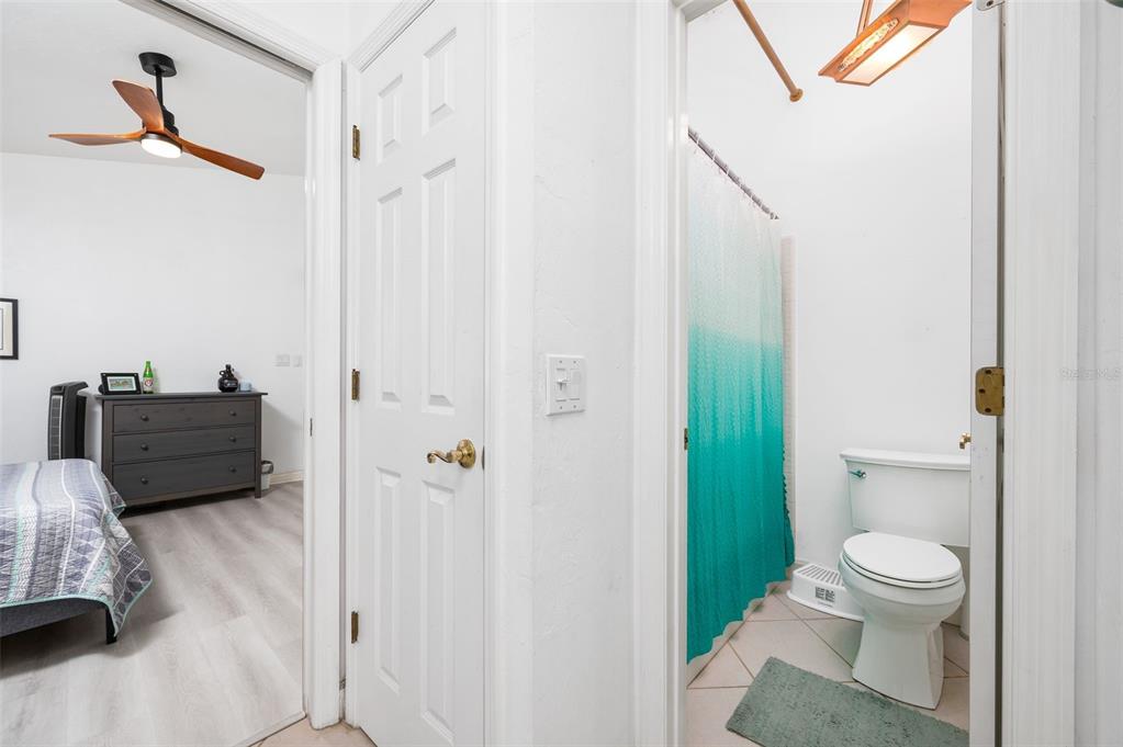 5154 Southwest 88 Terrace Gainesville, FL 32608 - Photo 24 of 29 a bathroom with a toilet sink and shower