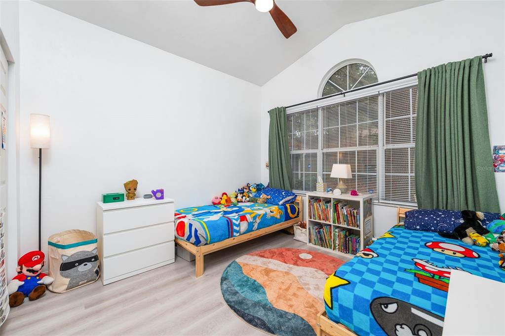 5154 Southwest 88 Terrace Gainesville, FL 32608 - Photo 25 of 29 a room with toys and a wooden floor