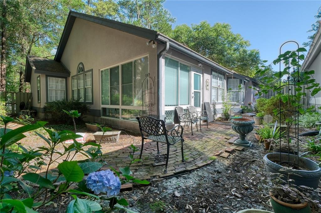 5154 Southwest 88 Terrace Gainesville, FL 32608 - Photo 28 of 29 a view of a house with backyard and sitting area