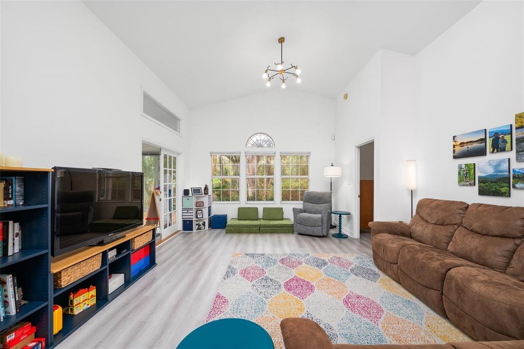 5154 Southwest 88 Terrace Gainesville, FL 32608 - Photo 6 of 29 a living room with furniture and a flat screen tv