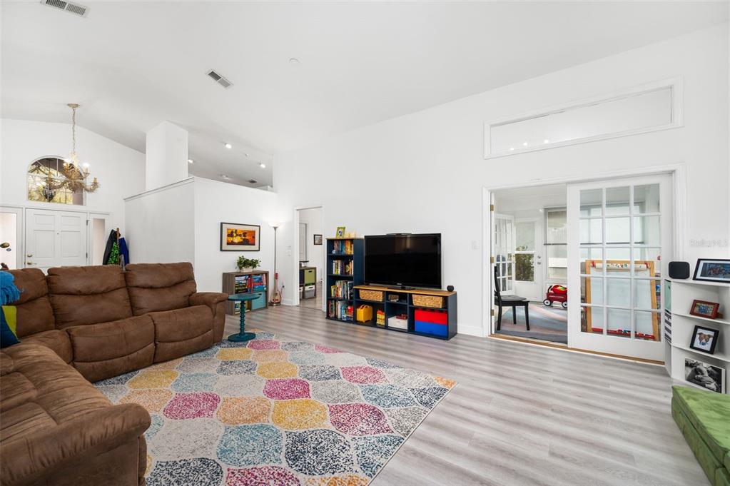 5154 Southwest 88 Terrace Gainesville, FL 32608 - Photo 7 of 29 a living room with furniture and a flat screen tv