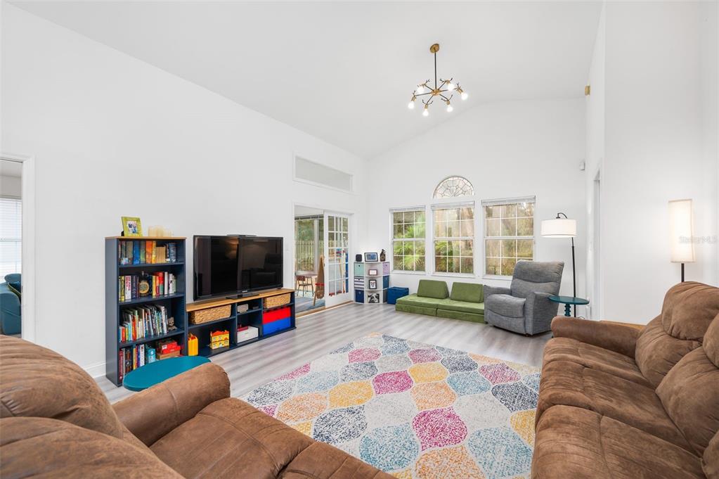 5154 Southwest 88 Terrace Gainesville, FL 32608 - Photo 9 of 29 a living room with furniture and a flat screen tv