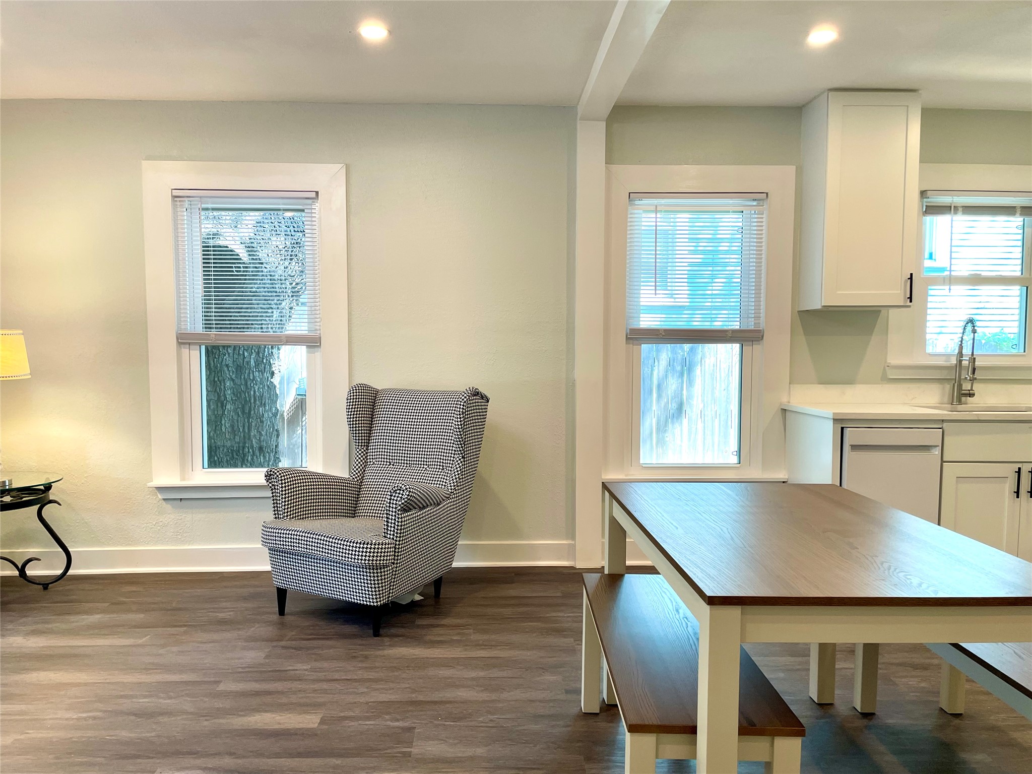 807 East Riverside Drive, Unit B Austin, TX 78704 - Photo 9 of 28 Clean lines and wood flooring create a versatile living area that flows seamlessly into the kitchen space.