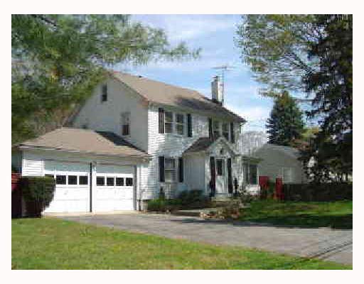 81 Lockwood Road Riverside, CT 06878 - Photo 2 of 5 a front view of a house with a yard