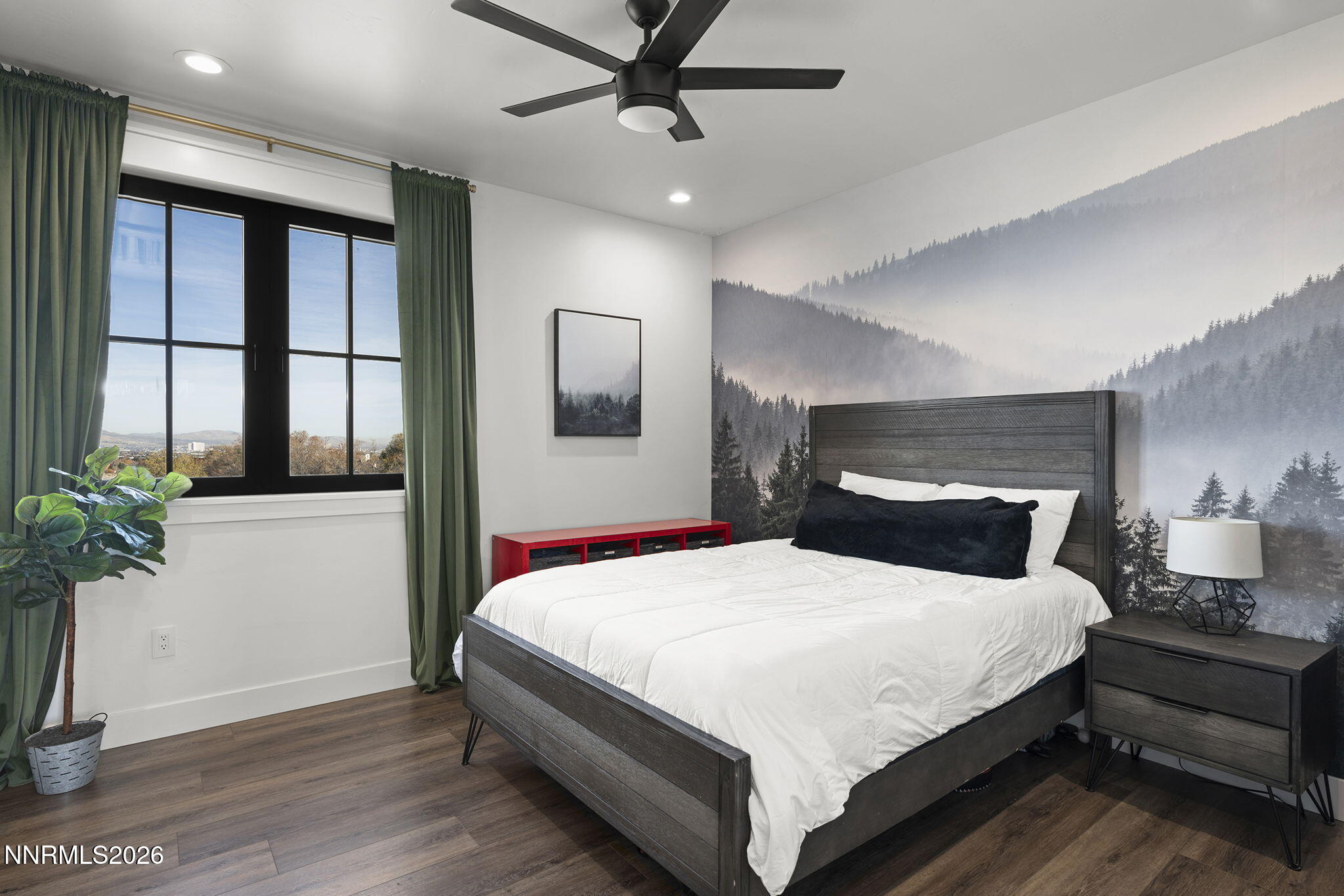 1426 Foothill Road Reno, NV 89511 - Photo 45 of 100 a bedroom with a large bed and a potted plant