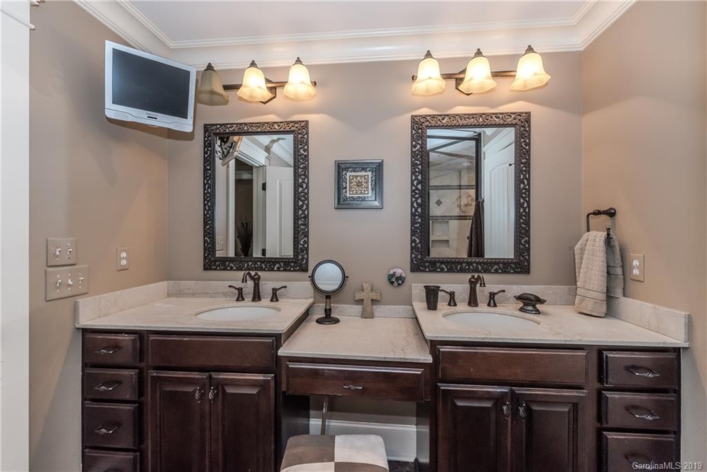 10023 Bora Bora Drive Tega Cay, SC 29708 - Photo 17 of 32 a bathroom with a sink and a mirror