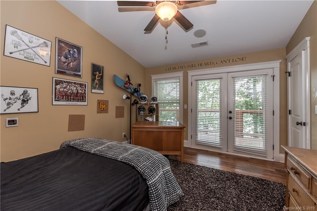 10023 Bora Bora Drive Tega Cay, SC 29708 - Photo 19 of 32 a bedroom with a bed and a window