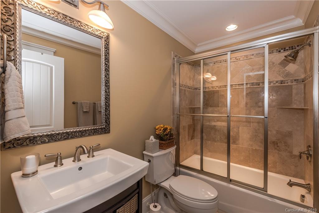 10023 Bora Bora Drive Tega Cay, SC 29708 - Photo 22 of 32 a bathroom with a sink a toilet and shower
