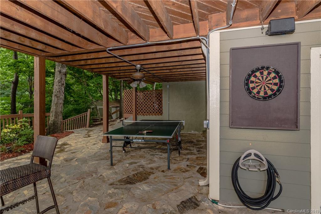 10023 Bora Bora Drive Tega Cay, SC 29708 - Photo 25 of 32 a backyard of a house with table and chairs