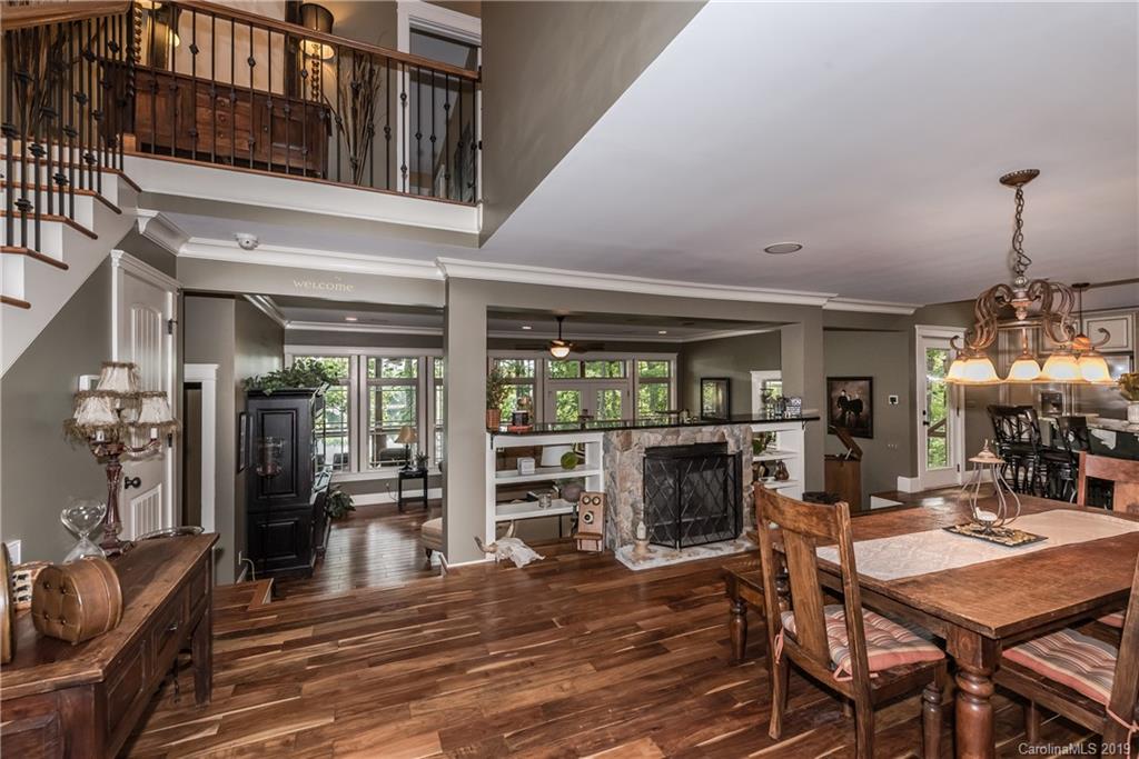 10023 Bora Bora Drive Tega Cay, SC 29708 - Photo 7 of 32 a view of a dining room with furniture window and wooden floor