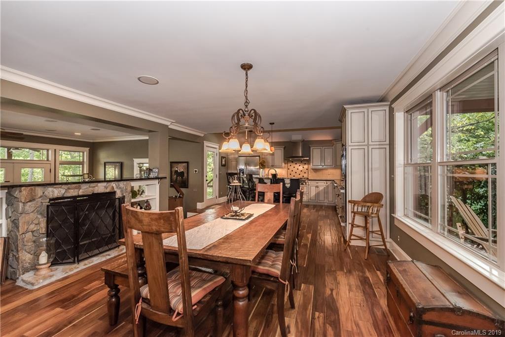 10023 Bora Bora Drive Tega Cay, SC 29708 - Photo 8 of 32 a view of a dining room with furniture window and wooden floor