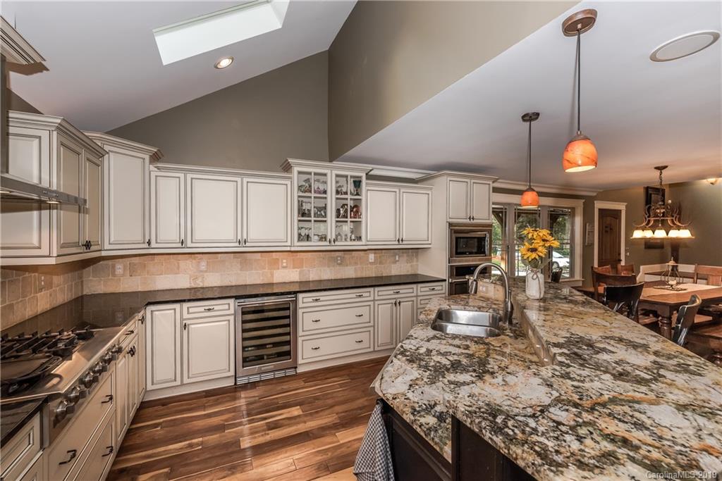 10023 Bora Bora Drive Tega Cay, SC 29708 - Photo 10 of 32 a kitchen with stainless steel appliances granite countertop a stove and a sink
