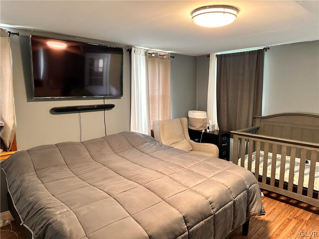 8547 Deer Road Slatington, PA 18080 - Photo 13 of 32 a bedroom with a bed and a flat screen tv