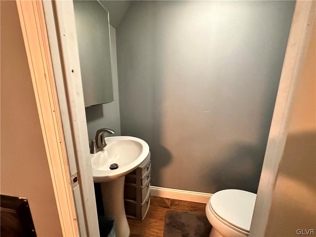 8547 Deer Road Slatington, PA 18080 - Photo 15 of 32 a white toilet sitting next to a sink and vanity