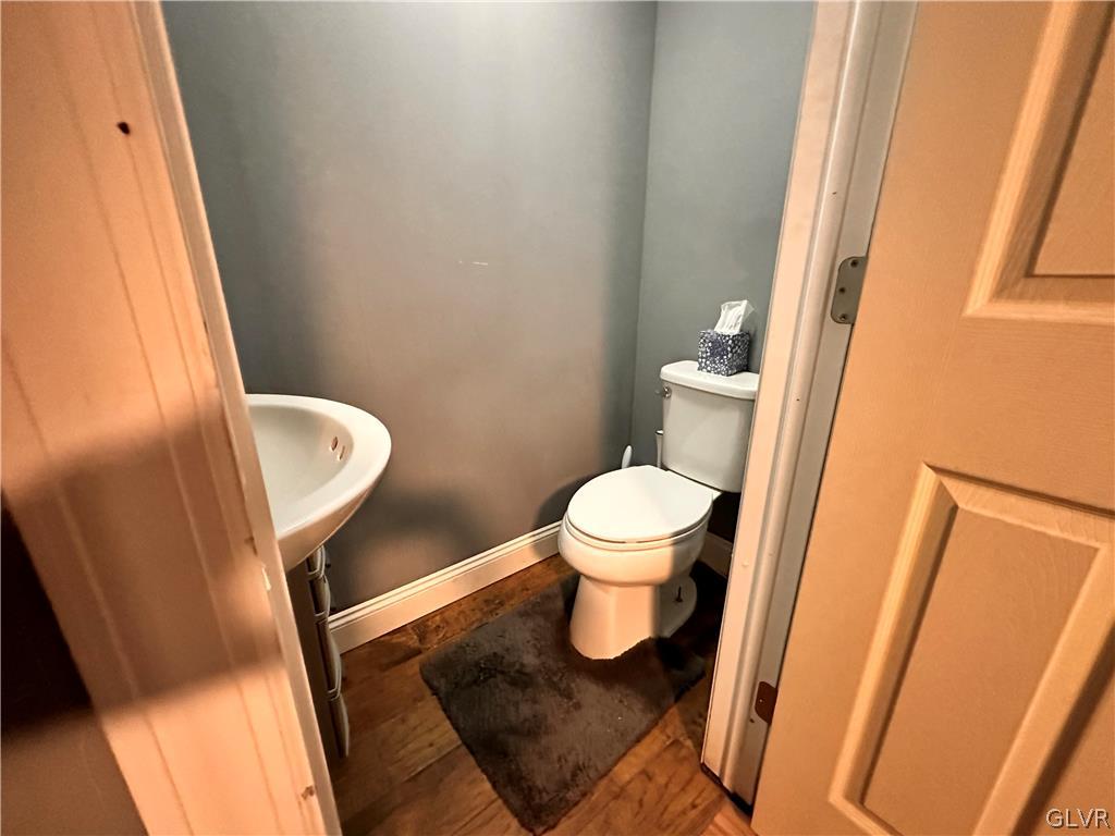 8547 Deer Road Slatington, PA 18080 - Photo 16 of 32 a white toilet sitting next to a sink and a mirror