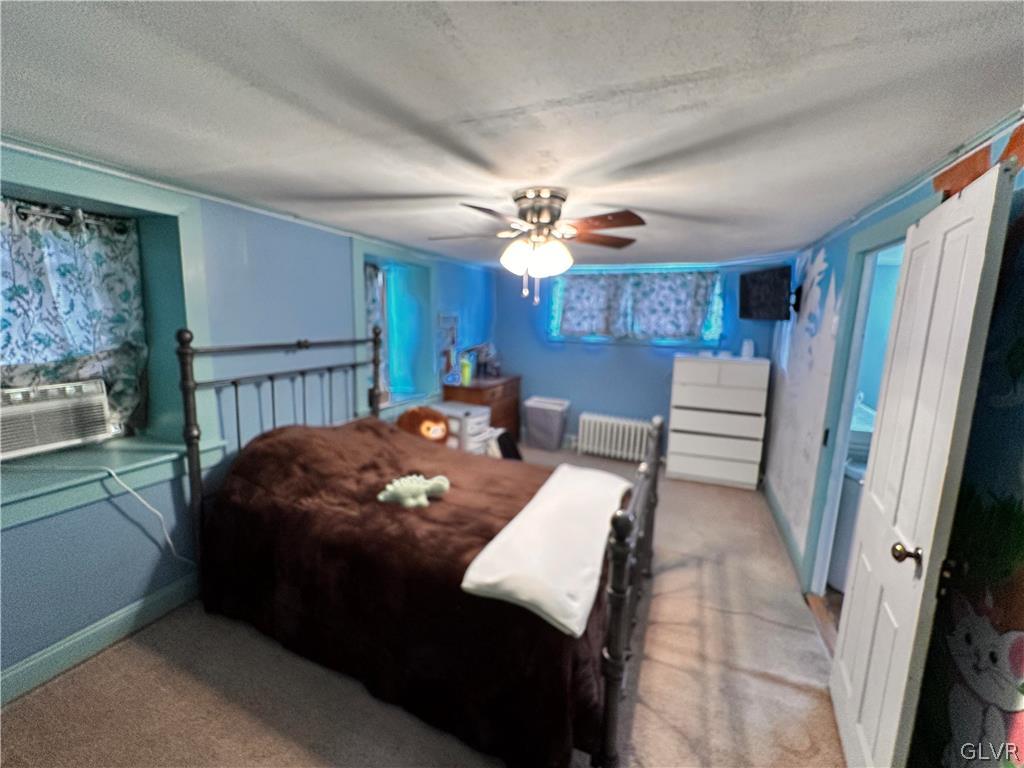 8547 Deer Road Slatington, PA 18080 - Photo 23 of 32 a living room with furniture and a chandelier
