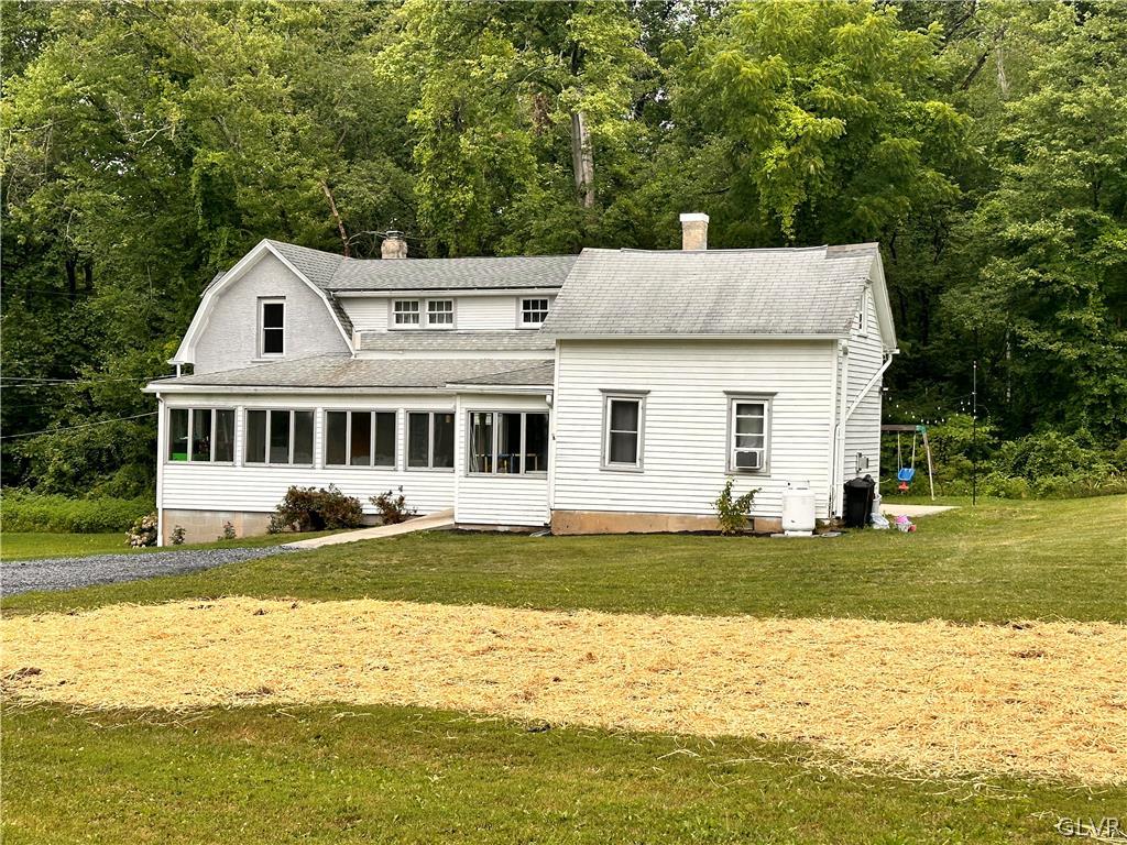 8547 Deer Road Slatington, PA 18080 - Photo 3 of 32 a house with a swimming pool in front of it