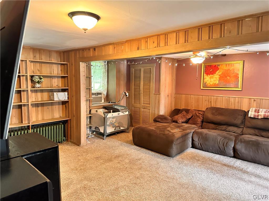 8547 Deer Road Slatington, PA 18080 - Photo 7 of 32 a living room with furniture a window and a chandelier