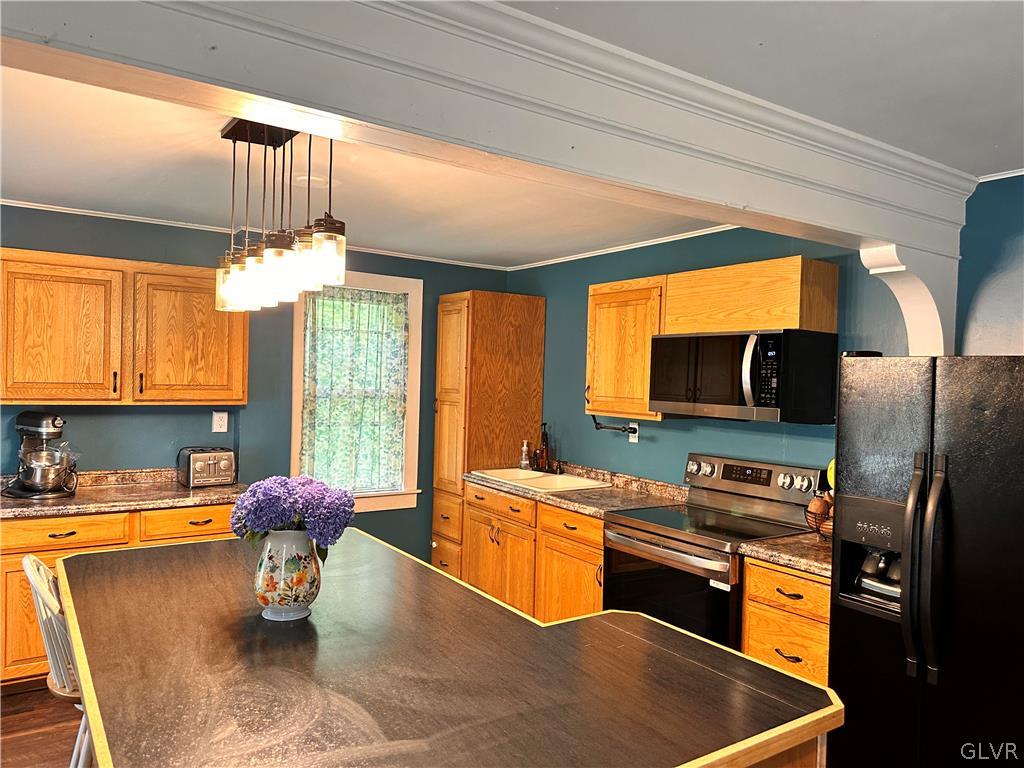 8547 Deer Road Slatington, PA 18080 - Photo 9 of 32 a kitchen with stainless steel appliances granite countertop a sink and a refrigerator