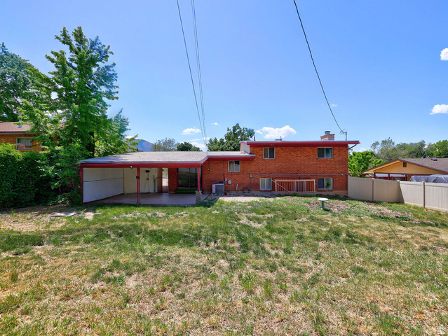 1272 Cook Street Ogden, UT 84404 - Photo 53 of 58 Brick exterior featuring a covered patio and an extended carport