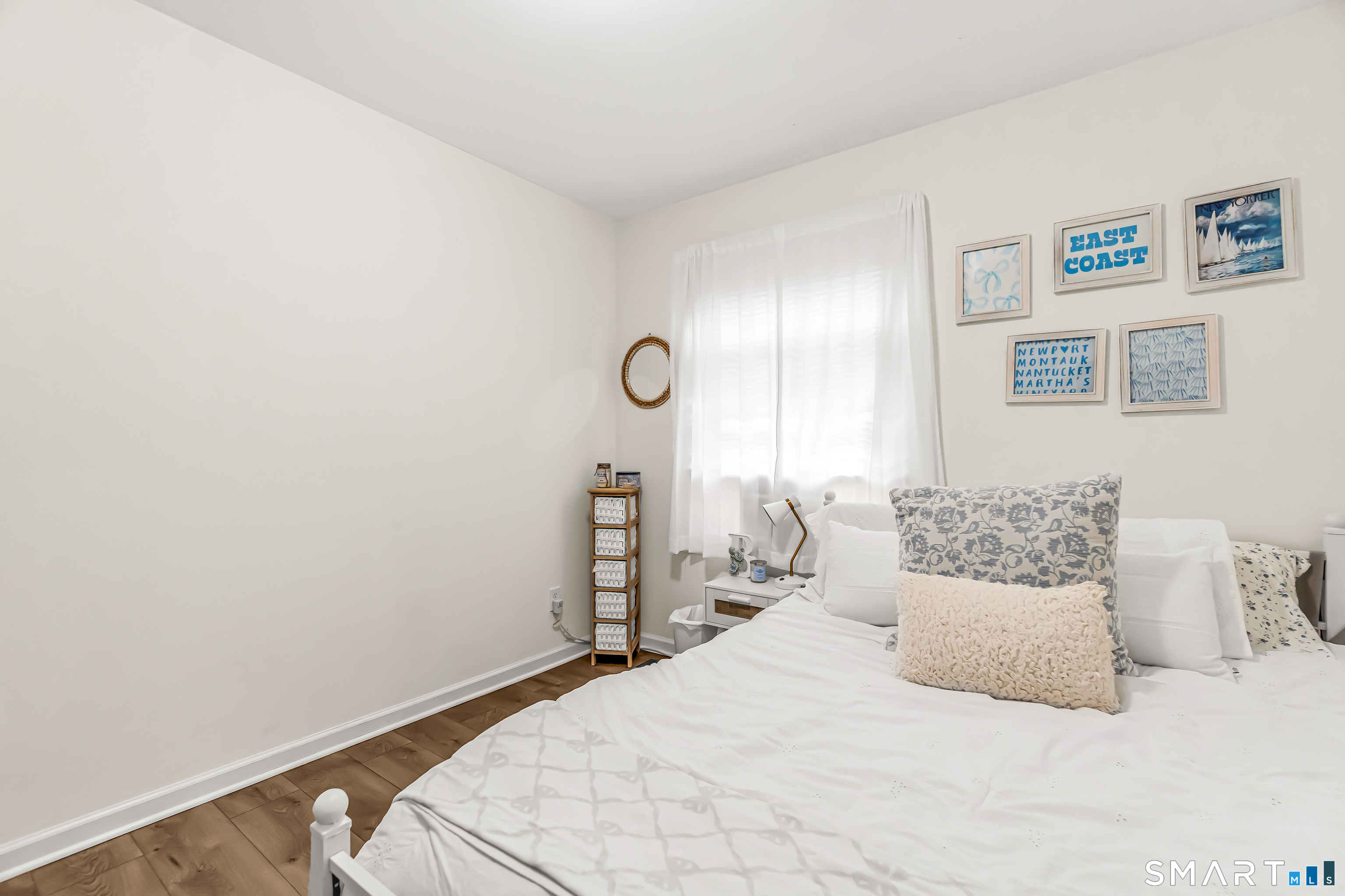 252 Bear Paw Road Bridgeport, CT 06606 - Photo 11 of 25 a bedroom with a bed and painting on the wall